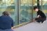 Lyric Aitkens helps her mother Renée Bombardier measure a window