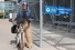 Nicole Noel on bike next to fenced shelter