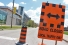 Road closed sign across Sunset Avenue