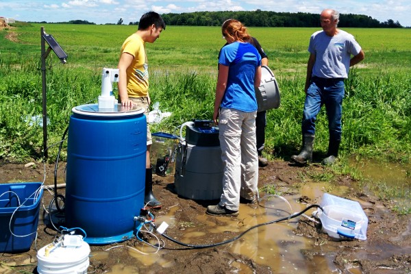 A group of graduate students from UWindsor researcher Bulent Mutus’ lab working with the biofilter, a filter that can remove potentially harmful phosphates from contaminated water. 