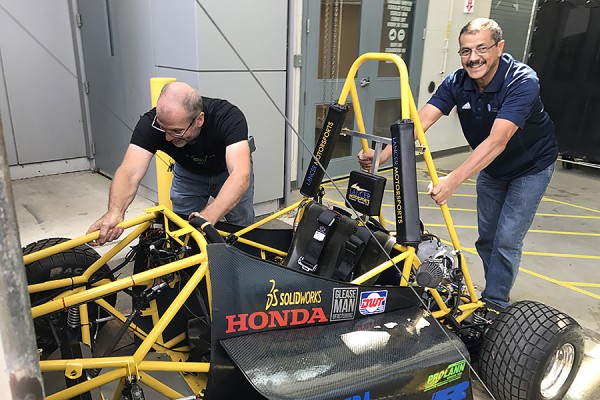 Andrew Jenner and Ram Barakat push vehicle