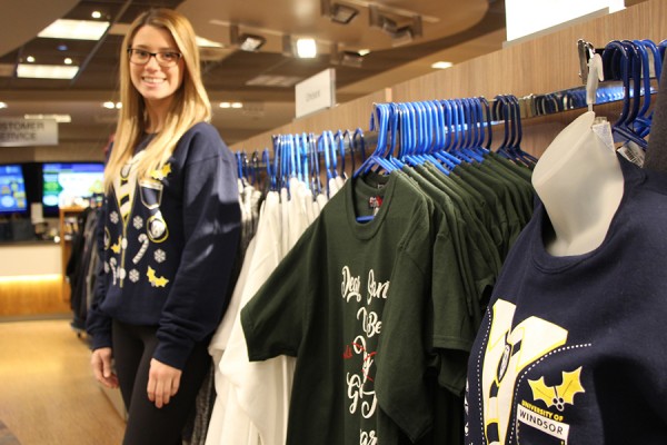 student trying on clothing at Campus Bookstore