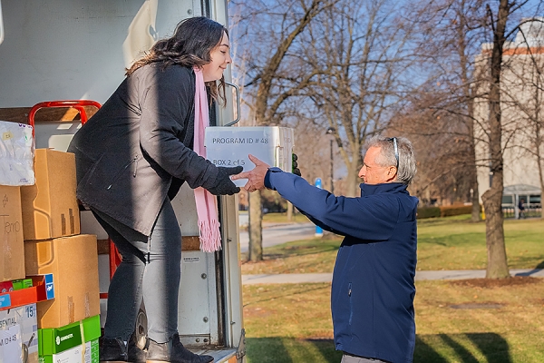 Mary Pallisco taking box from president Rob Gordon