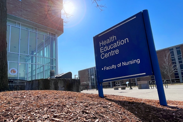 sign indicating offices of nursing faculty