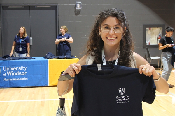 Petra Monaco holds T-shirt up