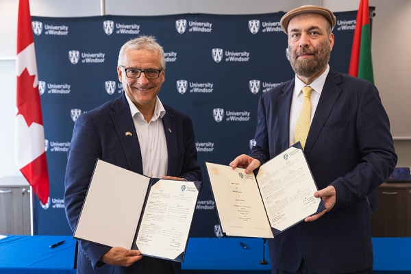 UWindsor president Robert Gordon and Al Qasimia University chancellor Awad Husain Al Khalaf holding signed Memorandum of Understanding