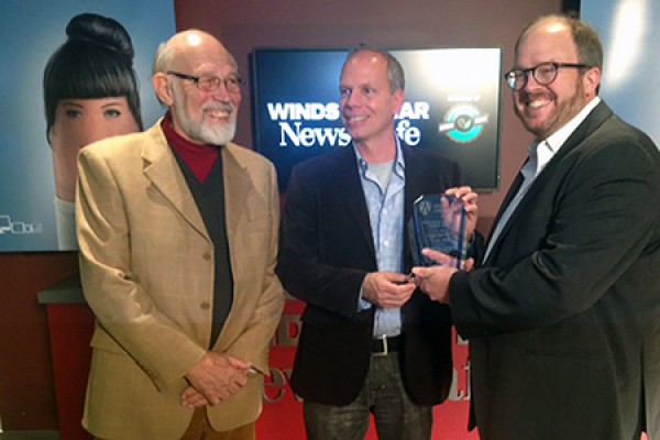 Larry Kulisek congratulates Craig Pearson and Daniel Wells