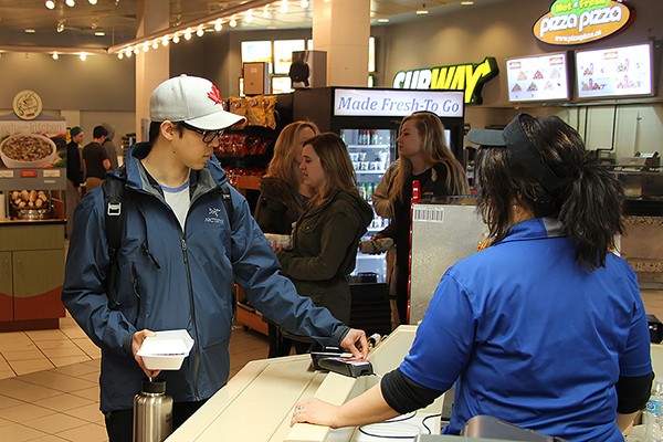 Brandon Loshusan buys lunch from cashier Milka Vasic