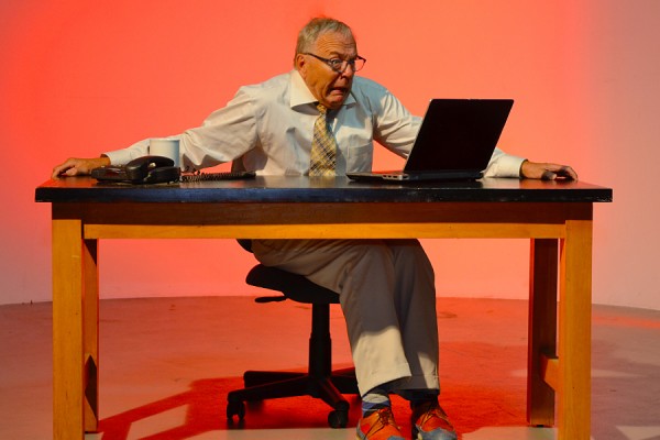 man looking at laptop computer in terror