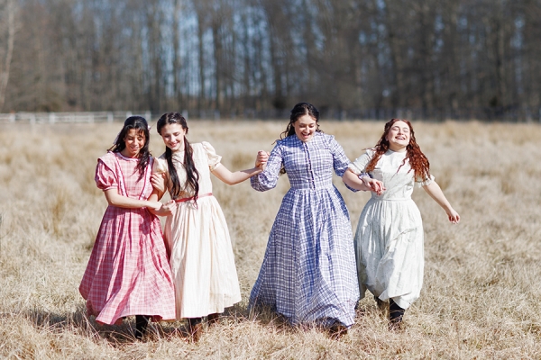 Gaia Martin del Fresno as Amy, Sierra Farnham as Beth, Alexa Dimoulas as Meg, and Lilly Battista as Jo