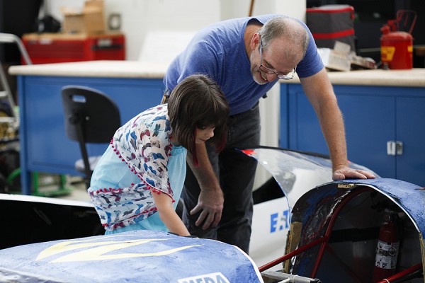 Masha Dmitrenko is shown an engineering capstone project by Andrew Jenner.