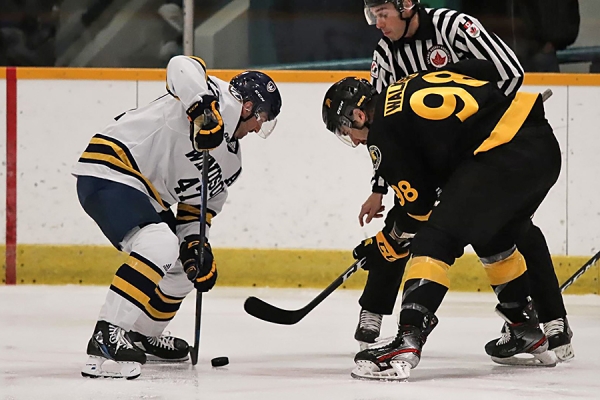 Lancer forward Mason Kohn takes a faceoff against the Waterloo Warriors.