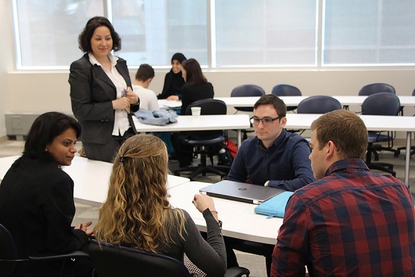 students at conference table