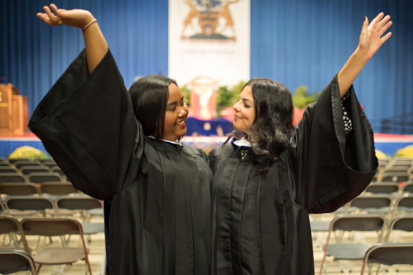 women wearing graduation gowns