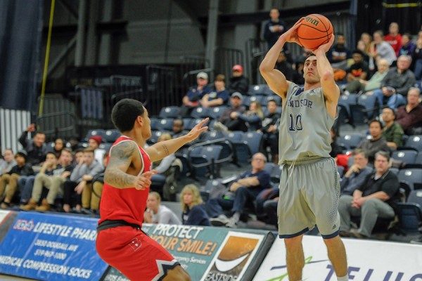 Mike Rocca takes a shot over a Brock defender