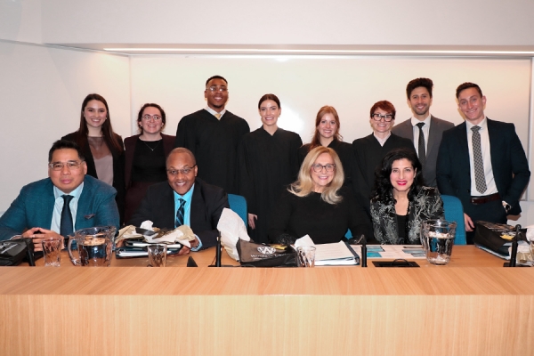 Law students standing behind Steve Coroza, Michael Tulloch, Sheilah Martin, and Renee Pomerance.