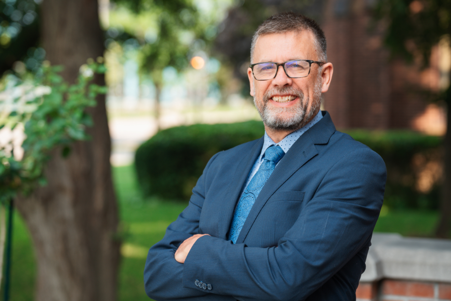 Dr. Ken Montgomery posing on the University of Windsor campus 