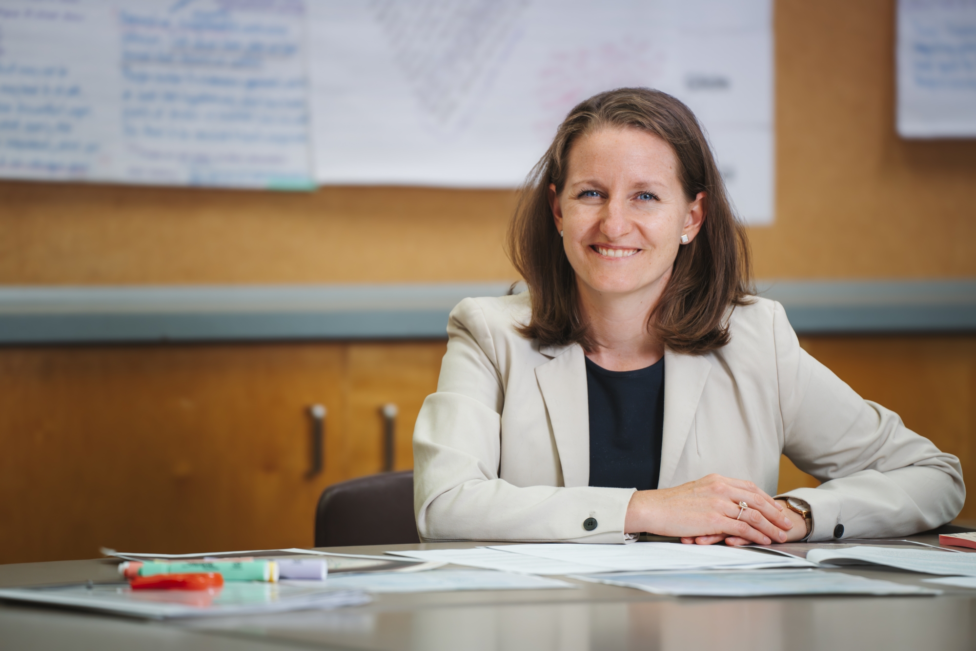 Dr. Catherine Vanner sitting at a desk smiling