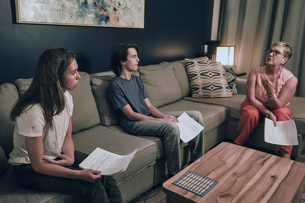 Student actors Olivia Sasso and Ewen Van Wagner review with Charlene Senn a script for an educational film on sexual assault resistance.