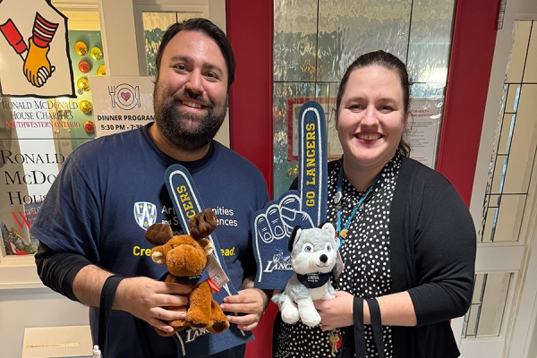 Ronnie Haidar of the Faculty of Arts, Humanities, and Social Sciences and Stephanie Porritt of the Ronald McDonald House at Windsor Regional Hospital celebrate World Kindness Day.