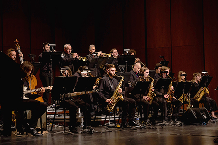 Members of the University Jazz Ensemble performing on the Capitol Theatre stage.