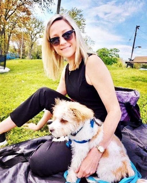 Marnie Kuhn with her dog "Wolfie" on a picnic