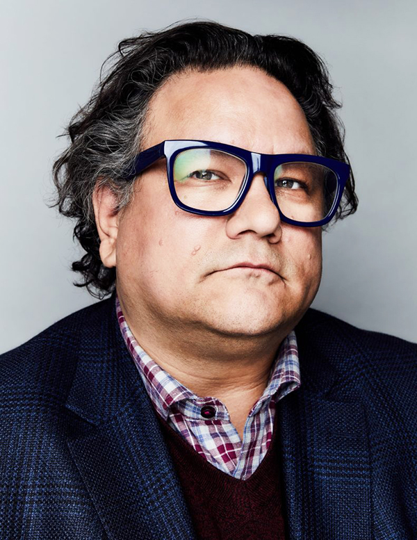 Photo of Jesse Wente, an Indigenous man with black hair and wearing black rimmed glasses