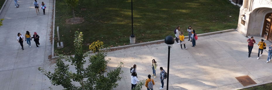 Drone view of students walking near Dillon Hall's east door