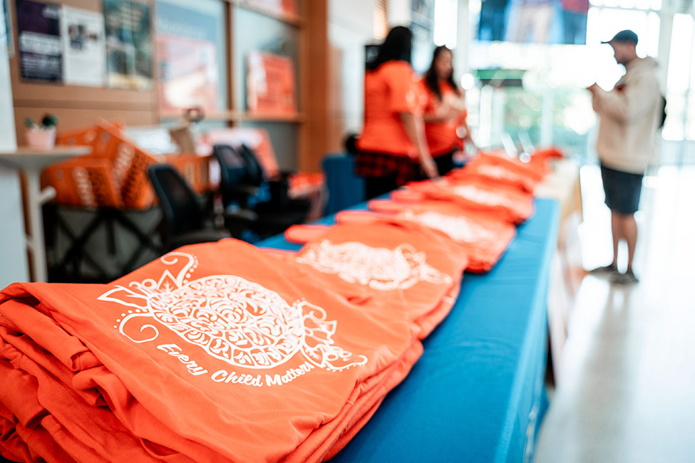 Orange shirt day shirts on a table