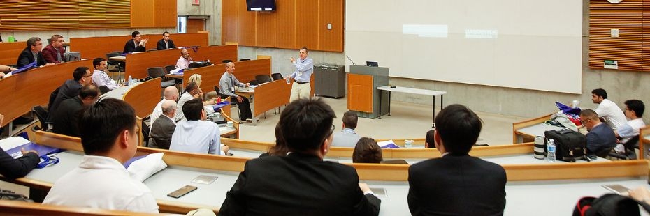 Professor teaching students in a large class room