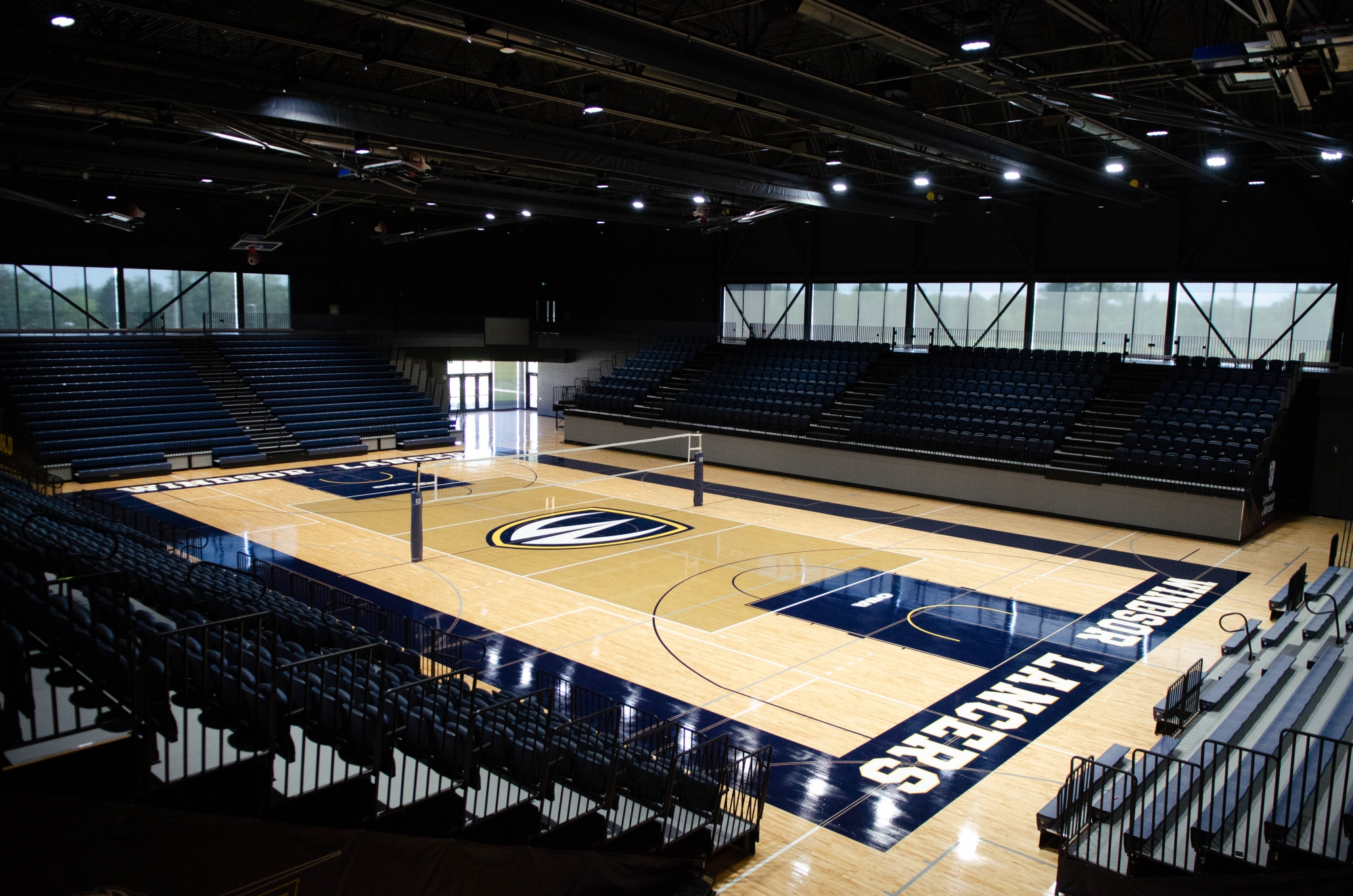 Windsor Lancer Varsity volleyball court with lancer shield in middle