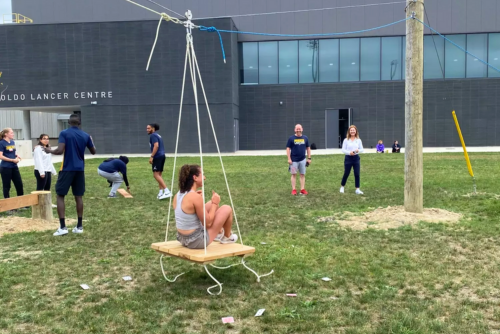 Participants on a cargo pully.