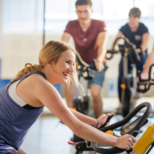 Instructor teaches spin class.