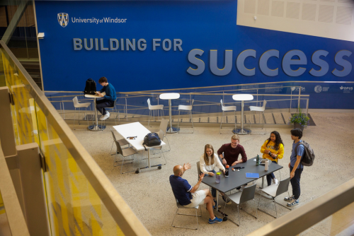 Students sit in the Dr. Richard Peddie Lancer Commons