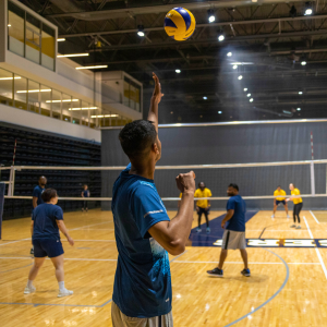 Participant serves volleyball.