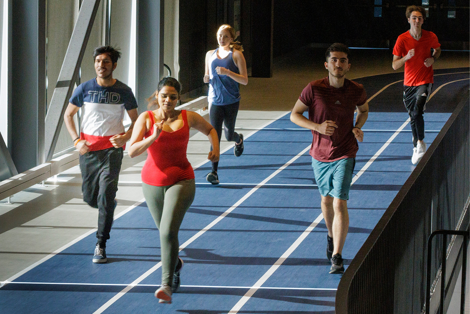 Members running on running track