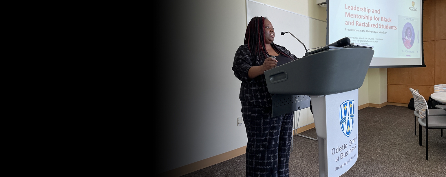 UWindsor alumna Dr. Bukola Salami speaking at podium