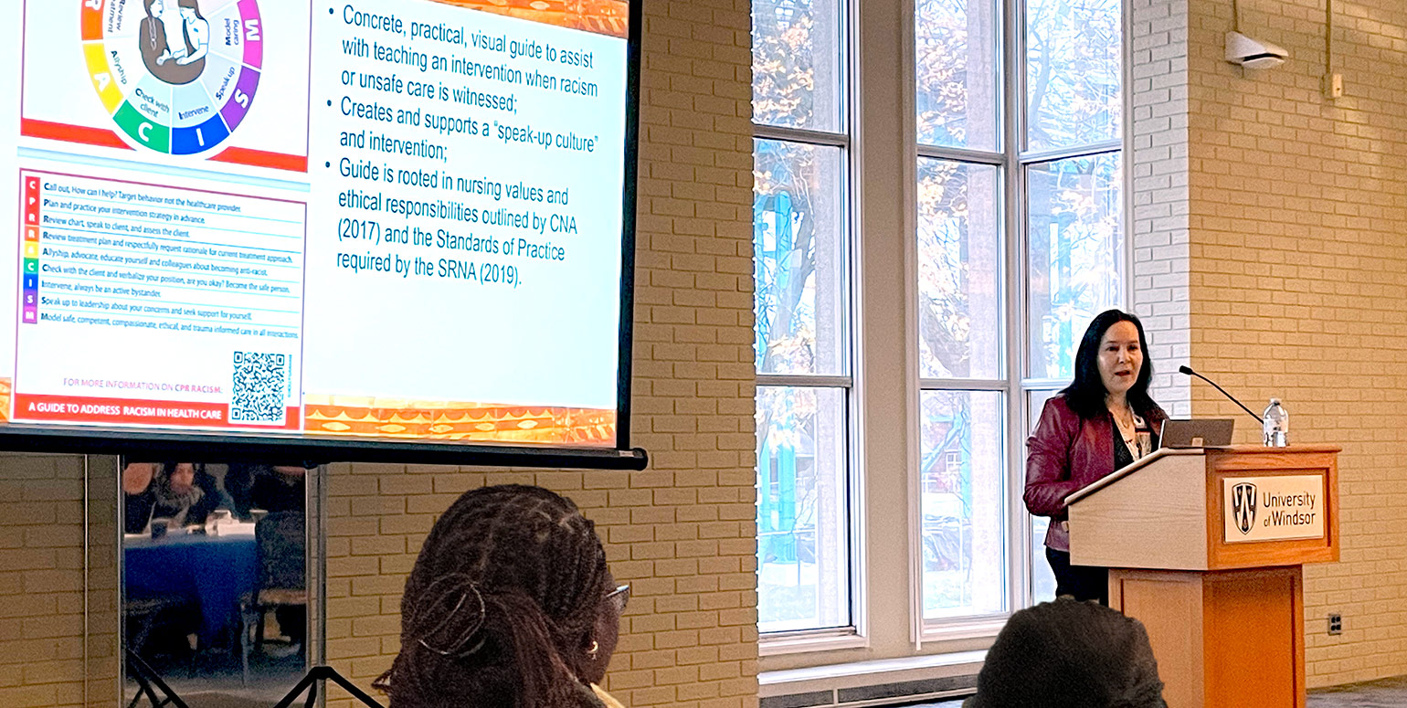 Dr. Holly Graham at the podium during her presentation