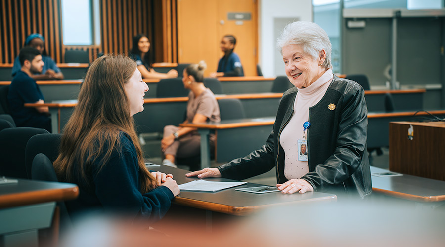 Professor Sharon Thorpe talks to one of her students in class