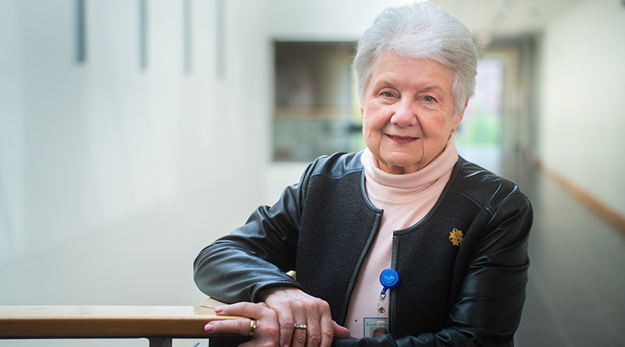 Professor Sharon Thorpe standing next in atrium
