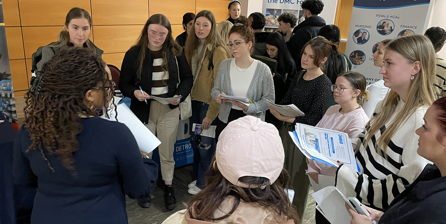 Group of nursing students in discussion with employer