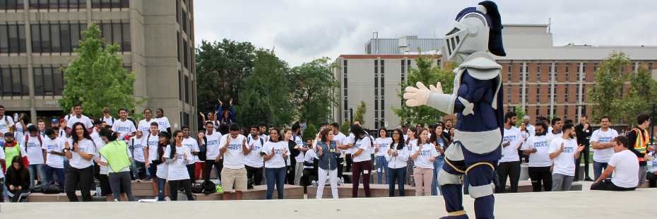 Group of students cheering with Winston, the Lancer's mascot 