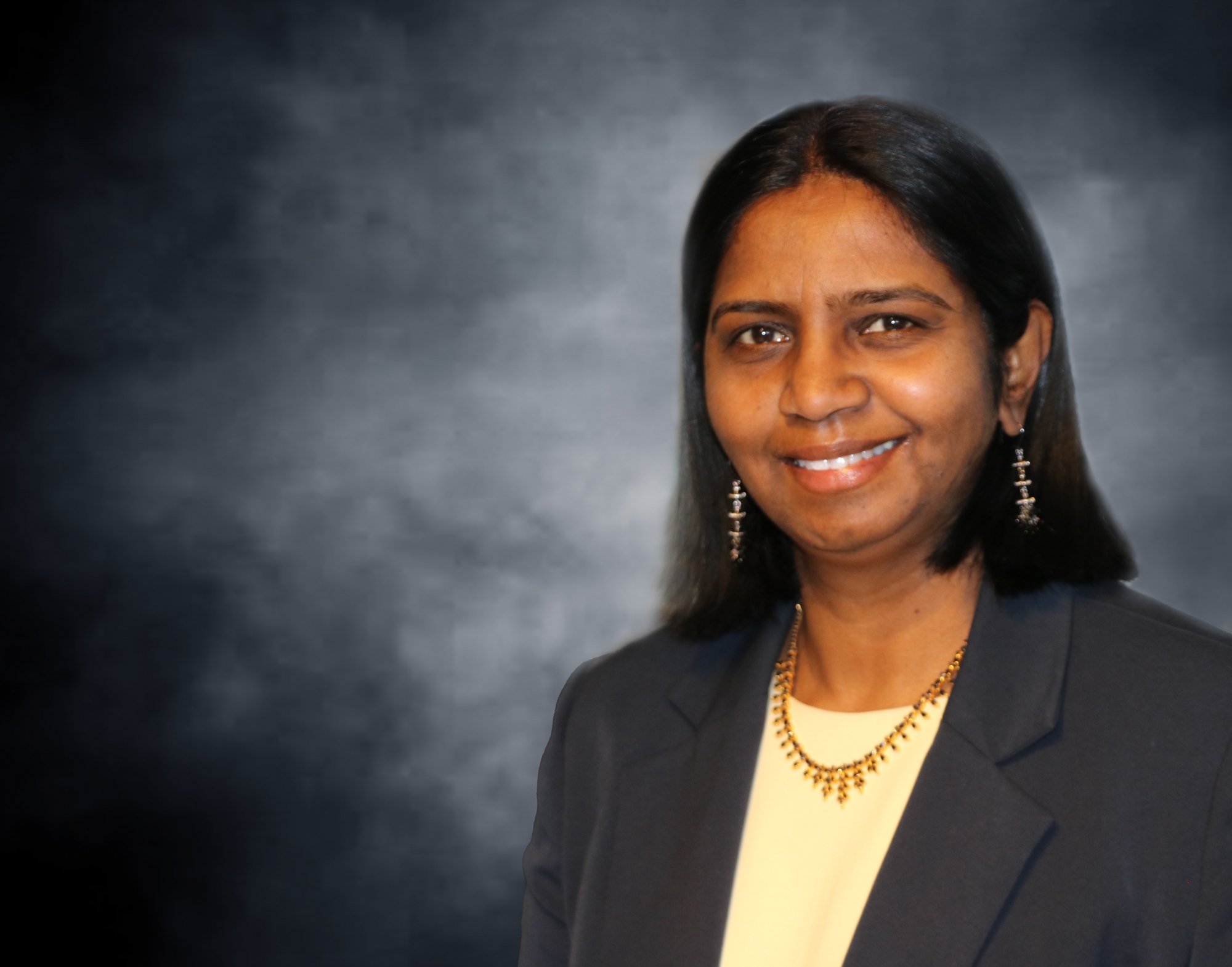 Dr. Shanthi Johnson smiles in a portrait photo