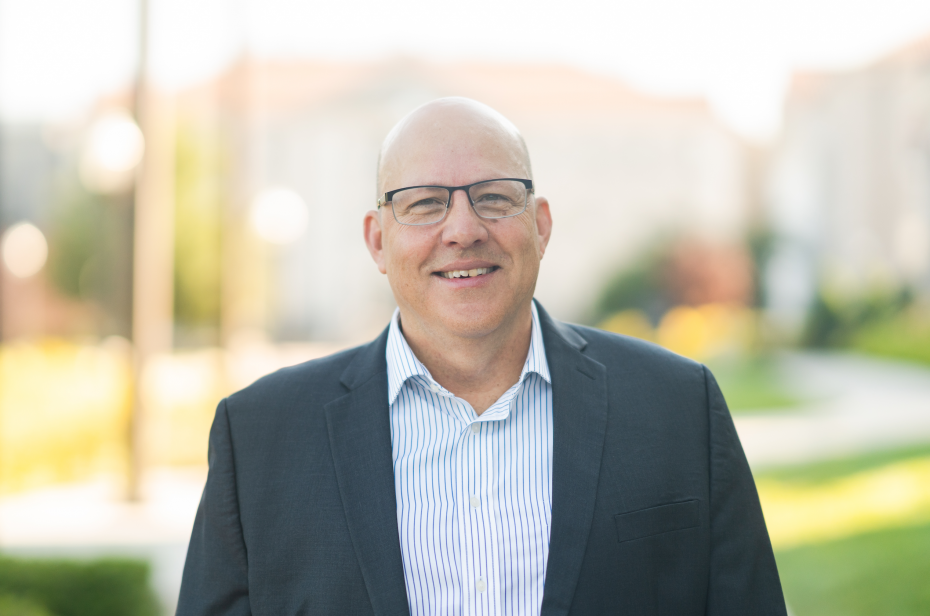 Robert Aguirre is pictured standing outside and is wearing glasses