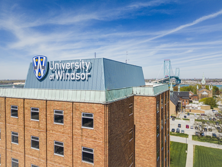 The University of Windsor&#039;s Residence Hall West is pictured with the Ambassador Bridge in the background.