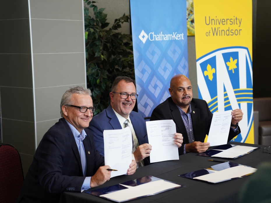 Robert Gordon, Darrin Canniff, and Michael Duben display the signed MOUs formalizing a partnership between UWindsor and Chatham-Kent on Nov. 22, 2024.