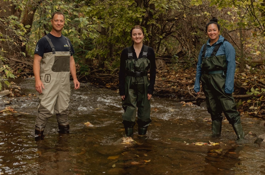 Trevor Pitcher, student Bri Curtis, and Catherine Febria stand in a stream in the Greater Toronto Area home to the redside dace. 