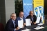 Robert Gordon, Darrin Canniff, and Michael Duben display the signed MOUs formalizing a partnership between UWindsor and Chatham-Kent on Nov. 22, 2024.