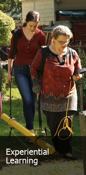 Students walking with Forensics equipment