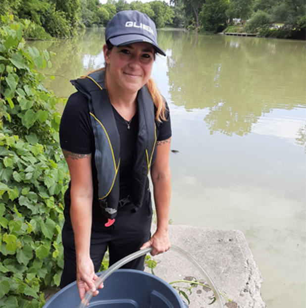 Emily Varga taking water sample